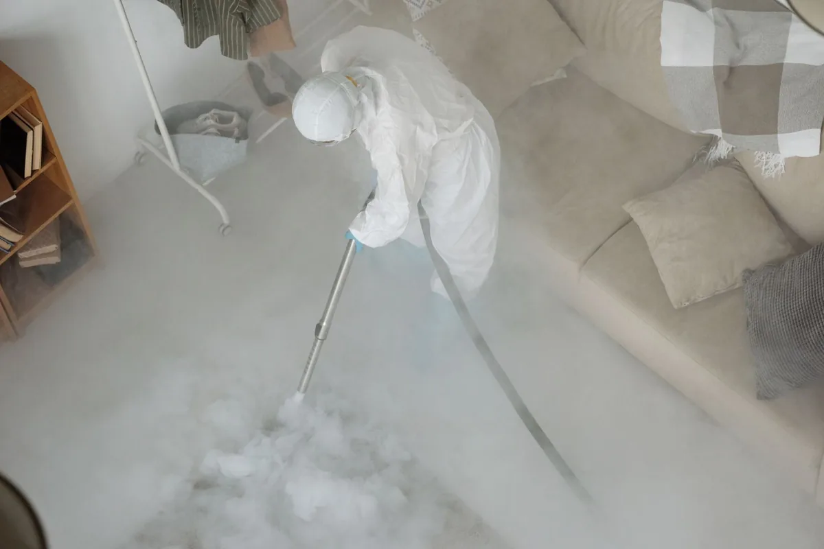 Biohazard cleanup technician in protective equipment, DeLand, FL